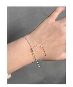 Close-up of S925 sterling silver snake chain bracelet with adjustable sliding bead