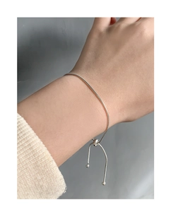 Detail of adjustable S925 silver slider bracelet with snake chain and round bead charms