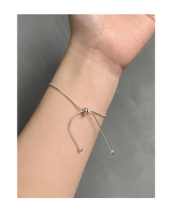 Detail of adjustable S925 sterling silver slider bracelet with elegant round beads