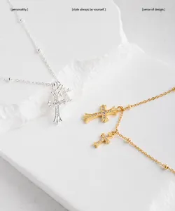 Detailed macro view of S925 sterling silver cross pendants with gold and silver finishes