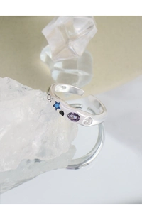 Detail of S925 silver ring featuring colorful zircons and engraved infinity symbol