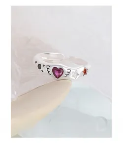Detailed macro view of S925 silver ring featuring heart gem and artistic doodle engraving