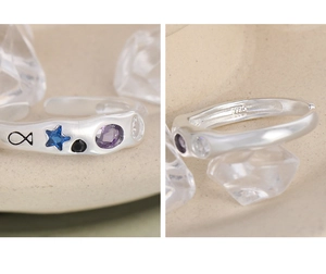Detailed macro view of S925 sterling silver ring showing the colorful zircon inlay and S925 hallmark