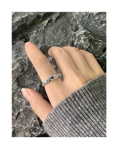 Close-up of S925 silver ring with multi-color zircon stones on a model's hand