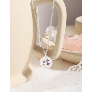 Elegant S925 silver necklace with circular pendant featuring four colored heart gemstones
