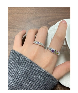 Close-up of S925 sterling silver rings with colorful heart-shaped cubic zirconia stones