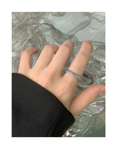 Close-up of minimalist S925 sterling silver gear pattern open ring on finger