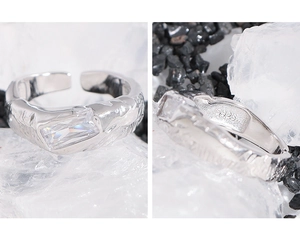 Close-up of S925 silver ring featuring pleated texture and micro-set zircon stone