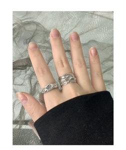 Detail of S925 sterling silver layered band and textured zircon ring for women