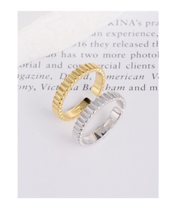 Macro detail of S925 sterling silver hallmark on gold and silver gear pleated rings