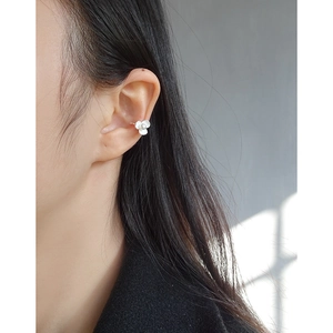 Minimalist S925 silver flower ear cuff with white petals and pearls on female model