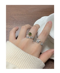 S925 silver ring set with olive green crystal stone and wavy heart-shaped cut-out band