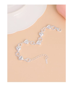 Macro shot of S925 sterling silver heart link bracelet with lobster clasp and extension chain