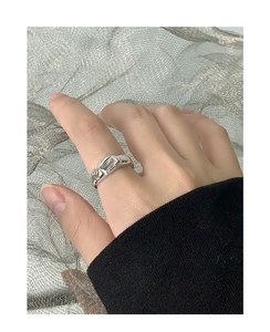 Macro view of S925 silver ring with wrinkled texture and rectangular zircon stone
