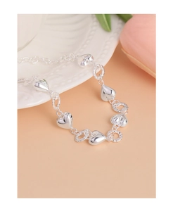 Macro detail of S925 sterling silver twist chain bracelet with polished heart charms