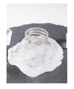 Macro shot of silver S925 multilayer ring featuring a pear-cut teardrop zircon stone