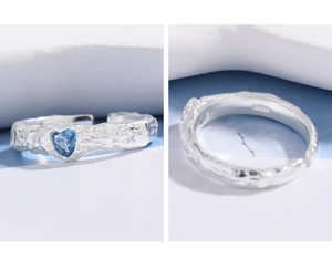 Macro detail of S925 sterling silver ring featuring a blue heart zircon and rock texture