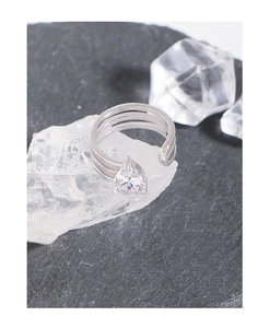 Macro view of S925 sterling silver ring with water drop zircon and triple band design