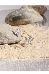 Detail of adjustable S925 silver ring featuring sparkling zircon snowflake design