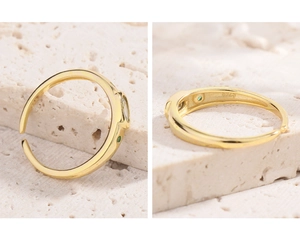 Detail view of gold S925 silver ring with rectangle green zircon and inner S925 stamp