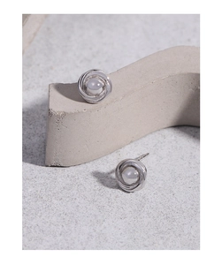 Macro shot of S925 sterling silver hoop earrings featuring moonstone center gems