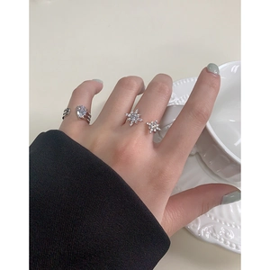 Elegant S925 silver starburst rings with pear-shaped cubic zirconia on hand