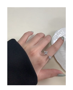Macro detail of S925 sterling silver ring with sparkling star zircon on fingers