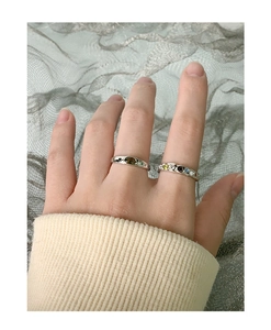 Close-up of S925 silver rings set with olive green and colorful zircon gemstones