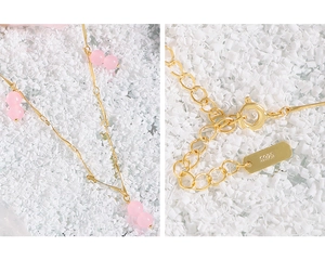 Detail view of pink agate beads on a S925 silver gold-plated chain with lobster clasp