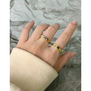 S925 silver gold-plated ring set with blue and green zircons on a model's finger