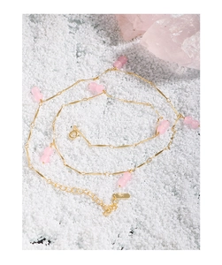 Macro detail of S925 sterling silver stamp and adjustable chain on pink bead necklace