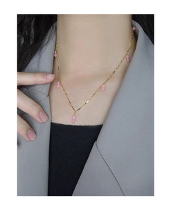 Close-up of S925 silver necklace with pink agate beads on professional model