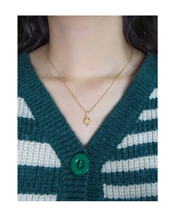 Detailed view of an S925 silver gold-plated star pendant necklace worn by a model