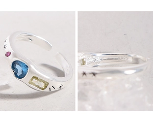 Detailed macro view of S925 sterling silver ring showing colorful zircon and hallmark
