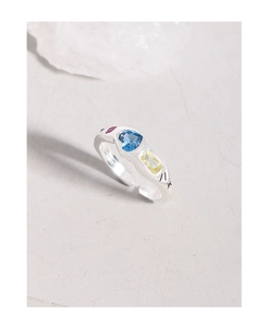 Macro detail of S925 sterling silver ring with colorful heart and rectangle zircon stones