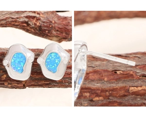 Detailed close-up of S925 sterling silver earrings with irregular blue opal inlay texture