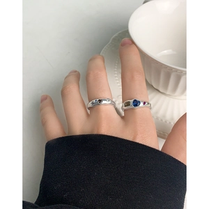 S925 sterling silver geometric rings with multi-colored zircons on hand with a white cup