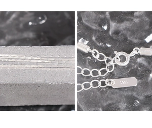 Detailed close-up of S925 sterling silver chain links and spring clasp connector