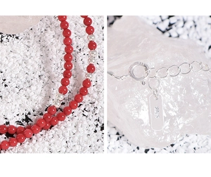 Close-up of S925 sterling silver clasp and red coral bead necklace with hallmarked tag