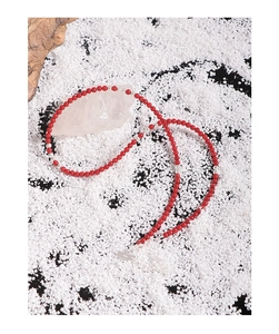 Detail view of red coral bead necklace showing S925 sterling silver lobster clasp and chain