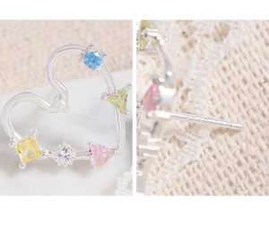 Detailed view of S925 silver stamp on heart earrings with rainbow colorful zircon