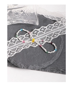 Detail of colorful faceted crystal beads and silver irregular nuggets on a stylish bracelet