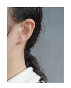 Macro view of S925 sterling silver mushroom stud earrings with cubic zirconia stones