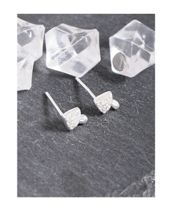 Macro shot of S925 sterling silver mushroom stud earrings with cubic zirconia stones