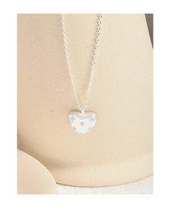 Close-up of S925 sterling silver heart pendant necklace with zircon star engravings