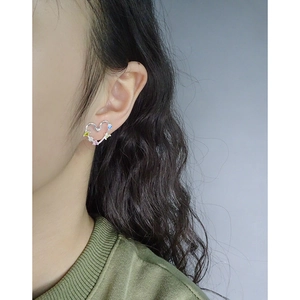 Elegant S925 silver heart earrings with rainbow cubic zirconia on female model