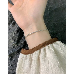 Elegant S925 sterling silver crushed silver style thin bracelet worn on woman's wrist