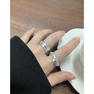 S925 silver rings with irregular lava texture and liquid metal design on model's hand