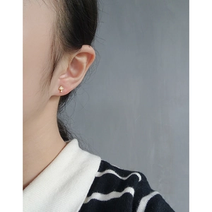 Minimalist S925 silver mushroom stud earrings with zircon inlay worn by a model