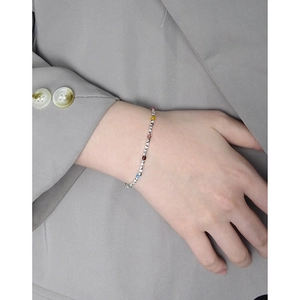 Chic S925 silver beaded bracelet with colorful crystal accents on a stylish model's wrist